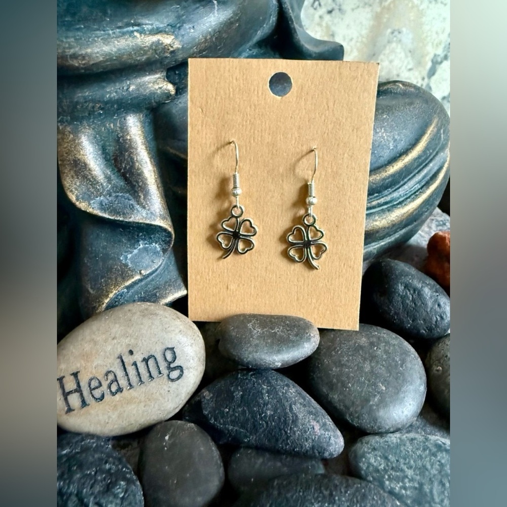 Stainless steel hook Four Leaf Clover earrings. Rubber backs. New in packaging.